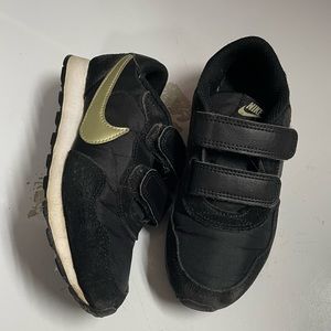 Kids black and gold Nikes - 12c / used without box